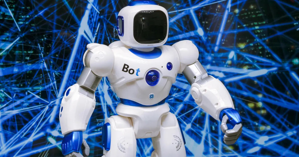 Une machine qui figure un assistant IA, en illustration de la section « Rendez votre entité non ambigue »