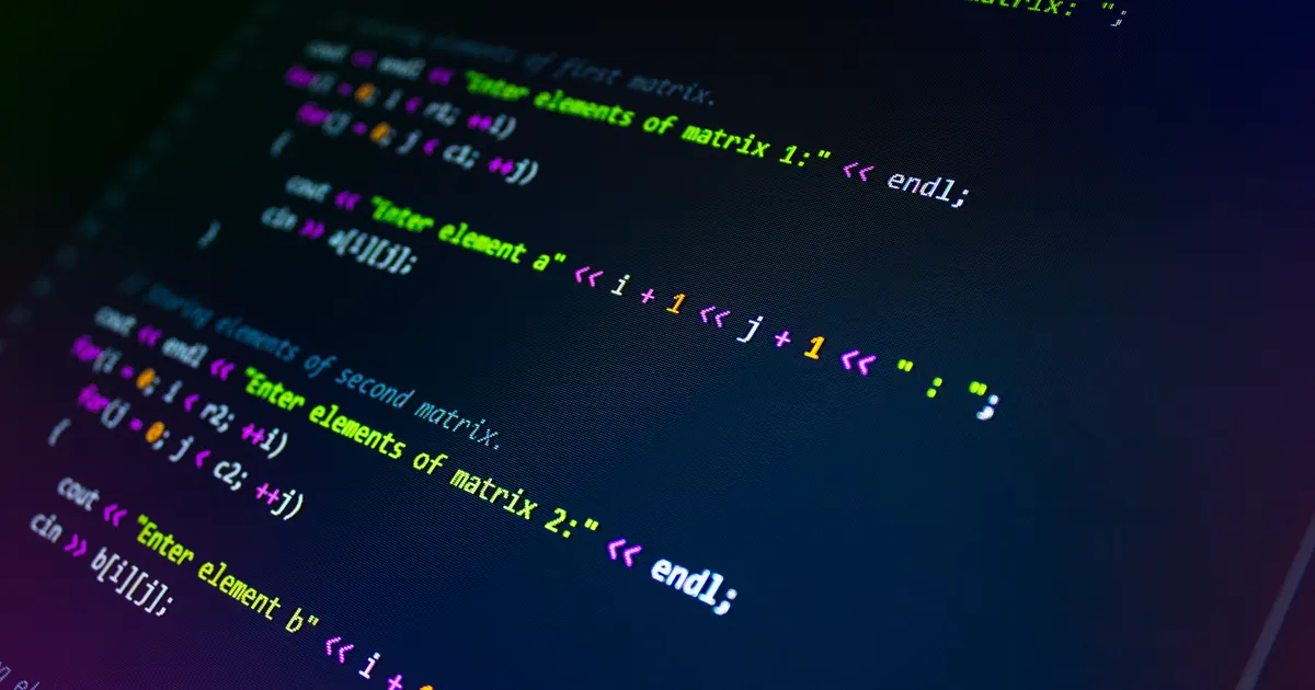 Close-up of colorful programming code displayed on a monitor screen, opening the guide “Programmatic SEO: scaling pages without producing spam”