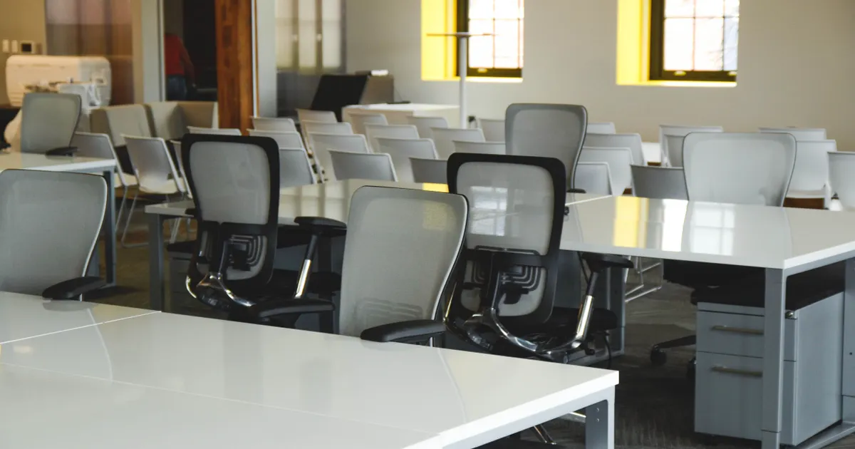 Spacious open office workspace with desks, chairs, and natural…, opening the guide “SaaS and B2B SEO: the playbook that survives a long sales cycle”