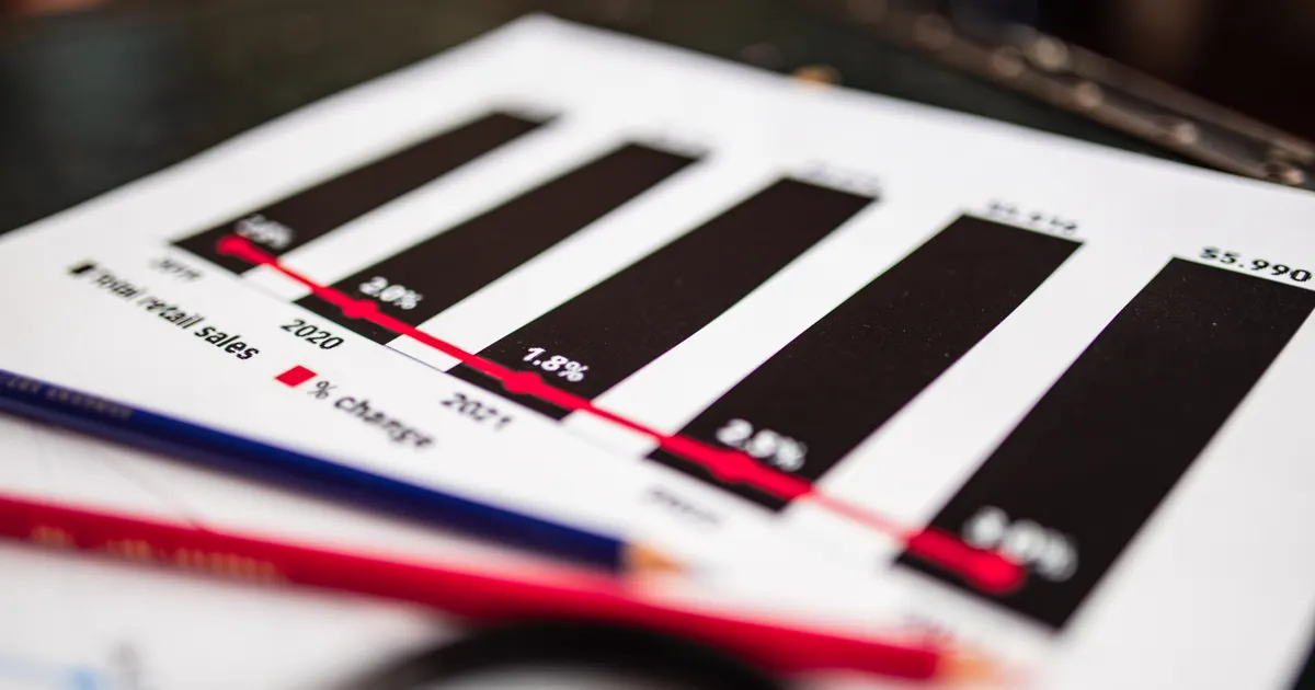 Close-up of a financial report showing sales data with dramatic depth of field, illustrating the SEO agency market statistics