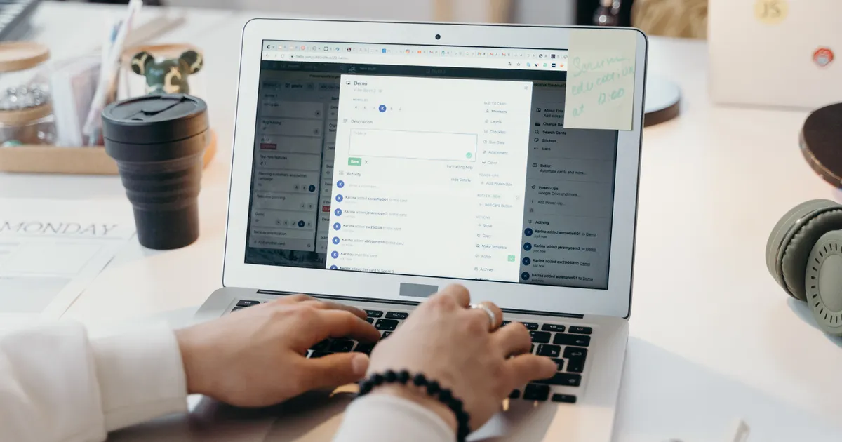 A person typing on a laptop in a bright, modern office setting, showing…, illustrating the Email Marketing agencies listed on Trust Agency